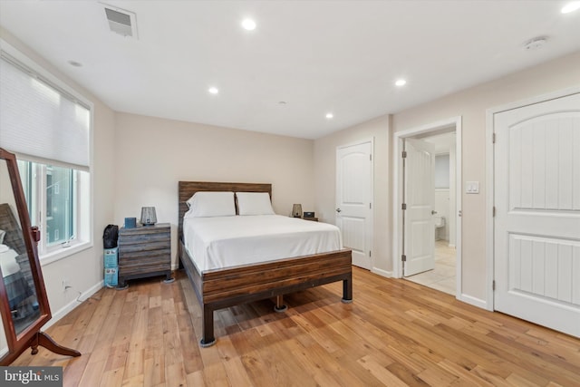 bedroom with light hardwood / wood-style flooring