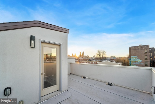 view of patio featuring a balcony