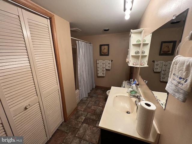 bathroom with vanity and shower / bath combo