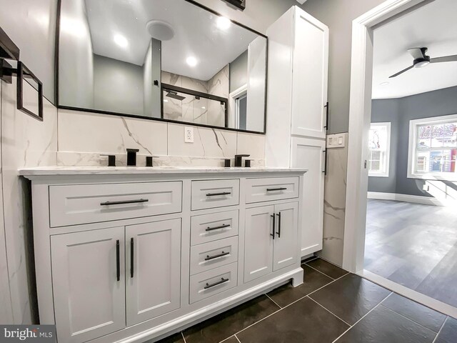 4827 N Warnock St, Philadelphia, PA 19141 - bathroom featuring tile walls, a marble finish shower, and vanity