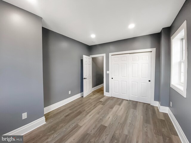 4827 N Warnock St, Philadelphia, PA 19141 - unfurnished bedroom with wood finished floors, a closet, and recessed lighting