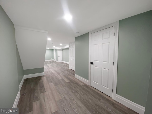 corridor with wood-type flooring