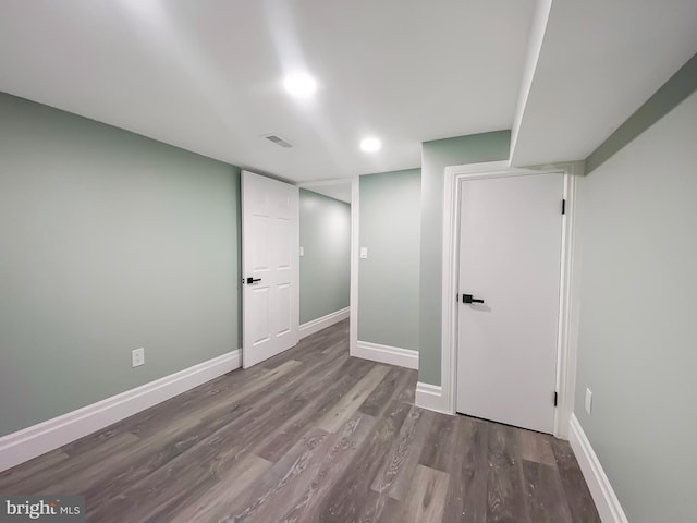 basement featuring hardwood / wood-style floors