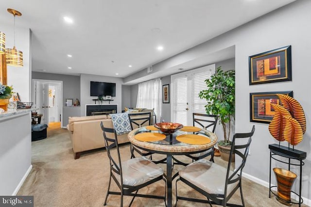 view of carpeted dining area