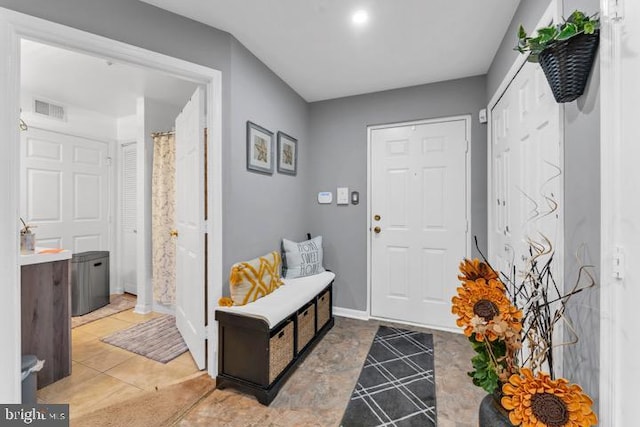 foyer entrance featuring tile patterned floors