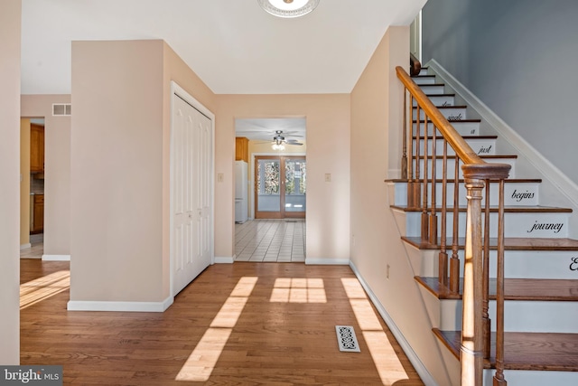 hallway with hardwood / wood-style floors