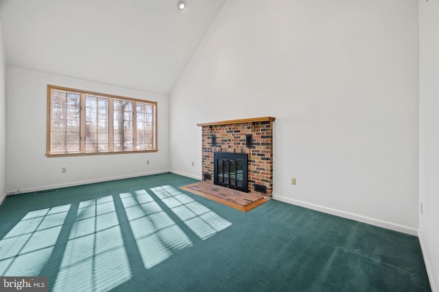 unfurnished living room featuring dark carpet, a fireplace, and high vaulted ceiling