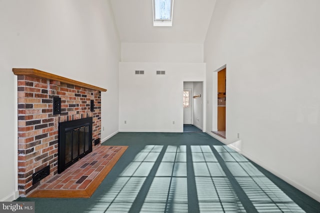 unfurnished living room with dark carpet, a fireplace, and a high ceiling