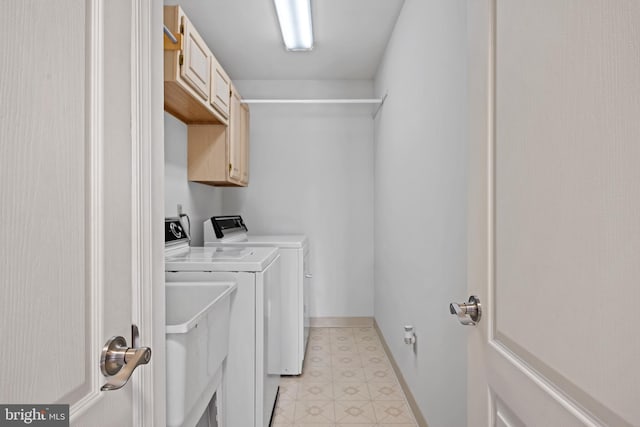 laundry room featuring cabinets and independent washer and dryer