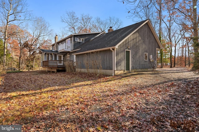 back of property featuring a sunroom