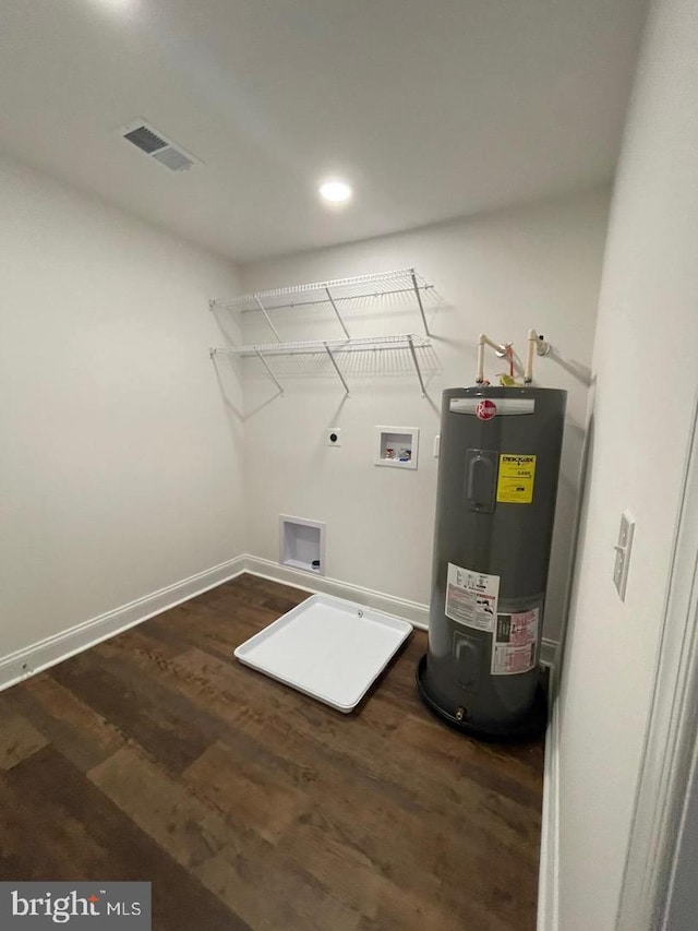 laundry area featuring water heater, washer hookup, dark hardwood / wood-style floors, and hookup for an electric dryer