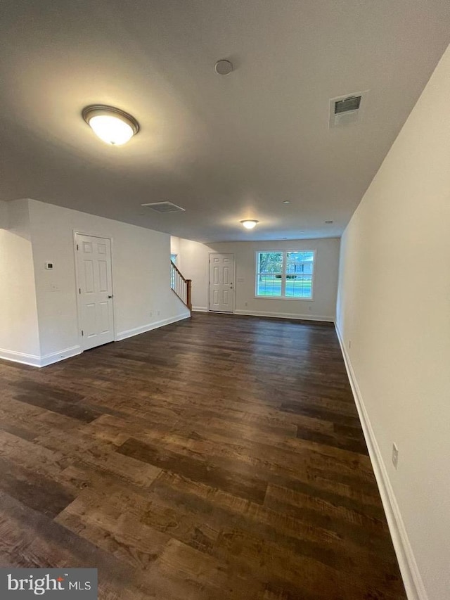 unfurnished room featuring dark hardwood / wood-style floors