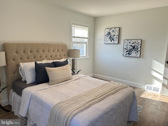 bedroom featuring hardwood / wood-style floors