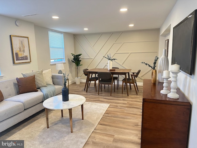 living room with light hardwood / wood-style flooring