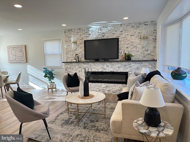 living room with a fireplace and hardwood / wood-style flooring