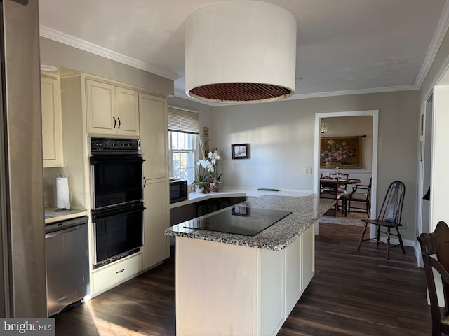 kitchen with black appliances, crown molding, light stone counters, a kitchen island, and dark hardwood / wood-style flooring