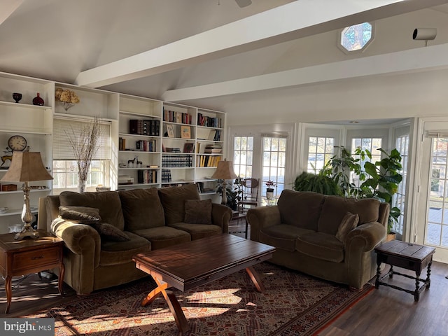 living room with lofted ceiling with beams and dark hardwood / wood-style flooring