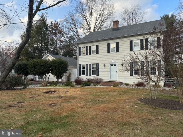 colonial house with a front lawn