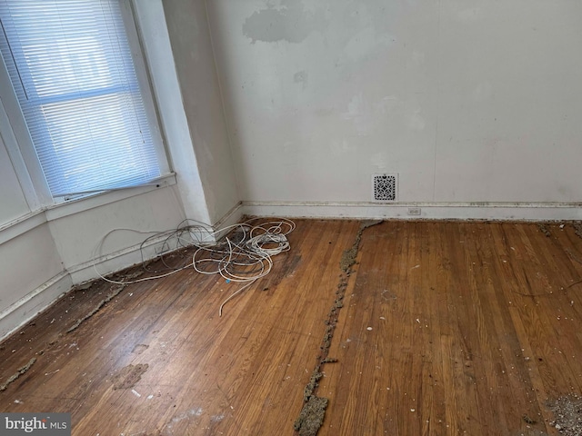 spare room with hardwood / wood-style flooring