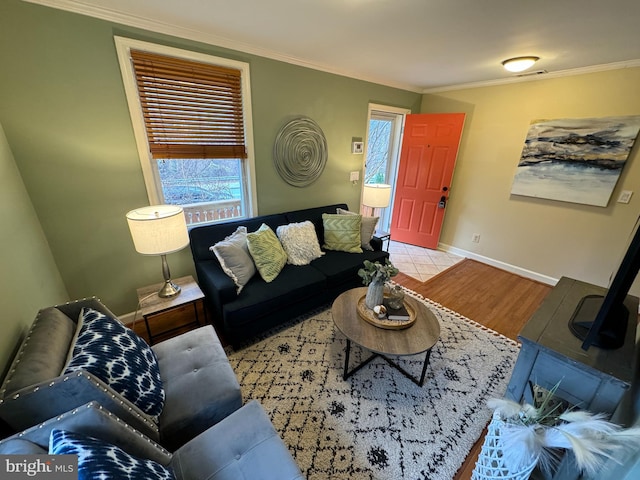 living room with crown molding and light hardwood / wood-style floors