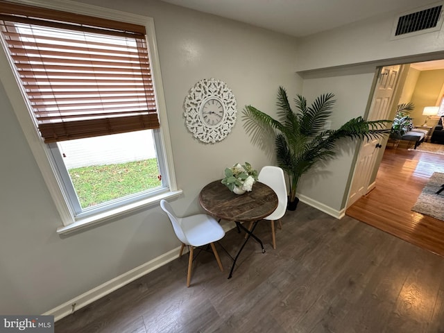 living area with dark hardwood / wood-style floors