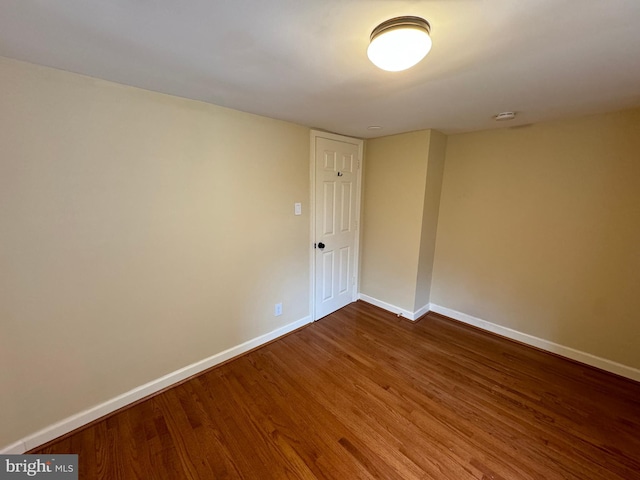 unfurnished room with hardwood / wood-style flooring