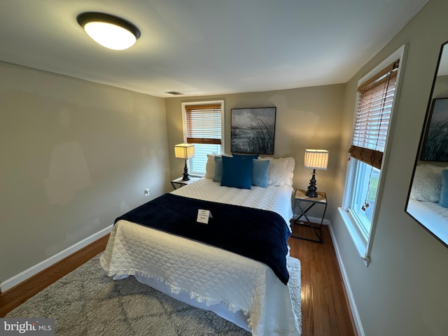 bedroom with hardwood / wood-style floors