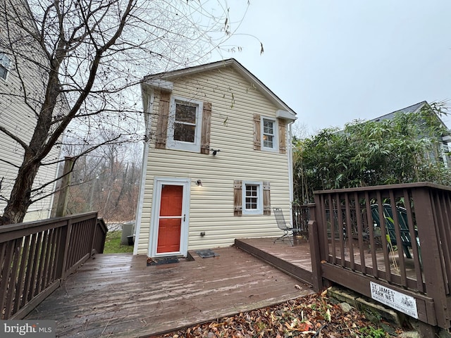 back of house featuring a deck