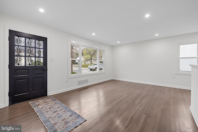 foyer entrance featuring dark hardwood / wood-style floors