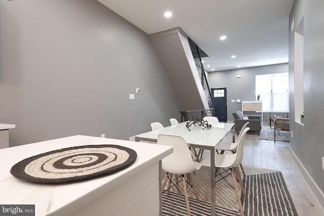 dining space with light wood-type flooring