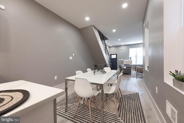 dining space featuring light hardwood / wood-style flooring