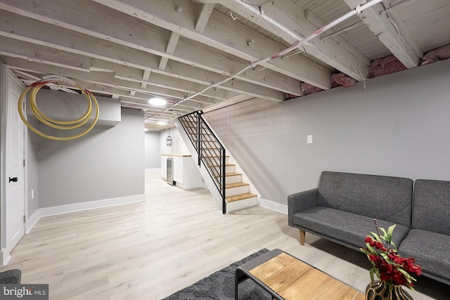 basement featuring hardwood / wood-style flooring