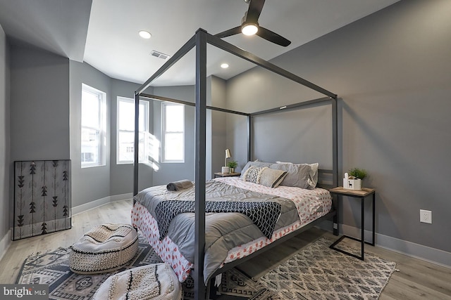 bedroom featuring light hardwood / wood-style flooring and ceiling fan