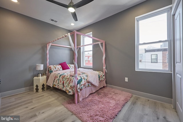 bedroom featuring ceiling fan and light hardwood / wood-style flooring