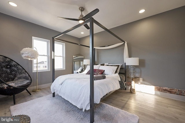 bedroom featuring ceiling fan and light wood-type flooring