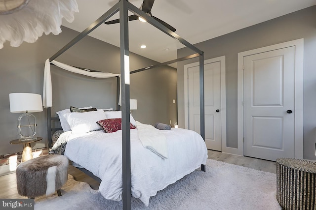 bedroom featuring light hardwood / wood-style flooring and ceiling fan