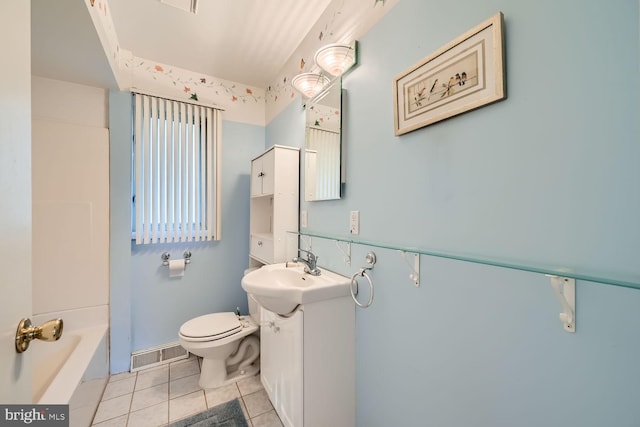 bathroom featuring tile patterned flooring, vanity, and toilet