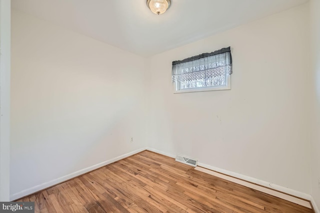 unfurnished room featuring light wood-type flooring