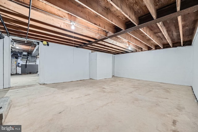 basement with heating unit and electric water heater