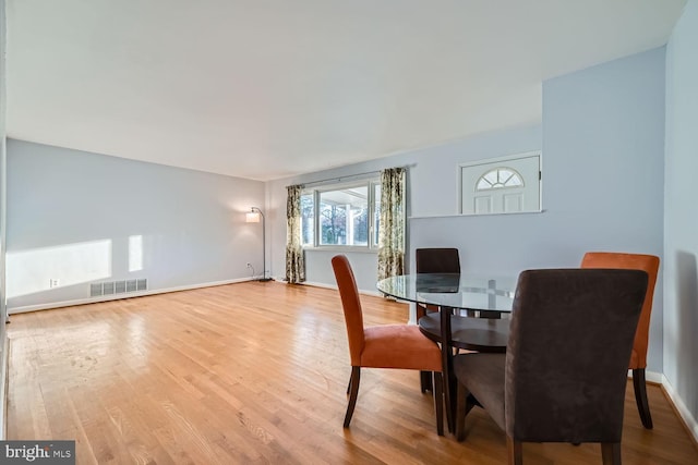 dining room with hardwood / wood-style floors