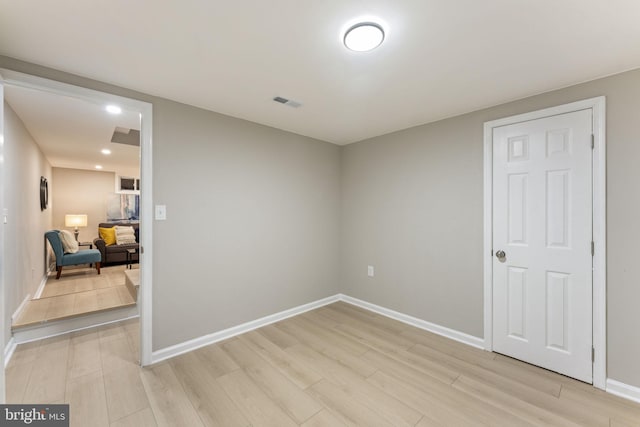 spare room featuring light hardwood / wood-style floors