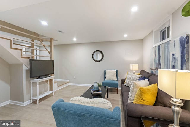 living room with light hardwood / wood-style floors