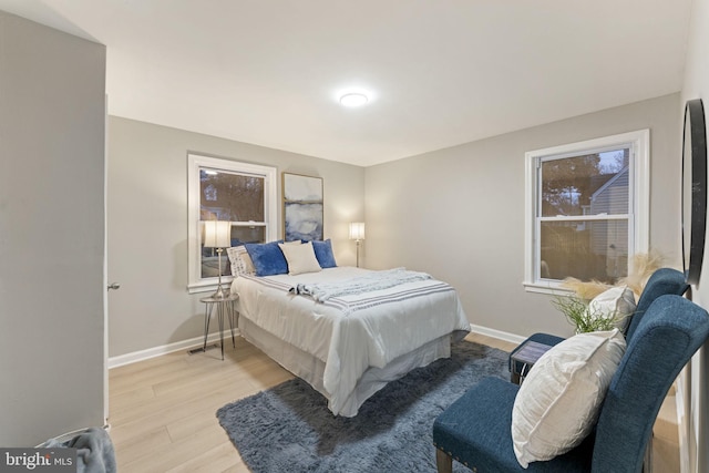 bedroom with light hardwood / wood-style floors