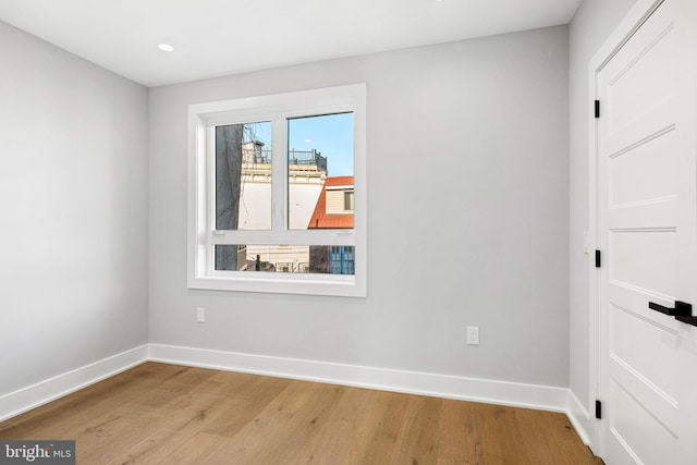 unfurnished room featuring light hardwood / wood-style flooring