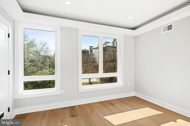 unfurnished room featuring hardwood / wood-style flooring