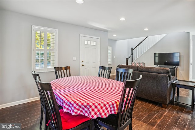 dining space with dark wood-type flooring