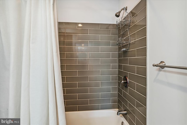 bathroom with shower / tub combo with curtain