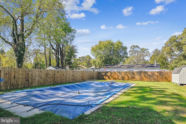 view of sport court featuring a yard and a covered pool