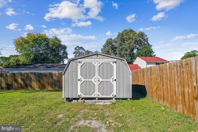 view of outbuilding with a yard