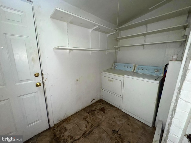 laundry area with washing machine and clothes dryer